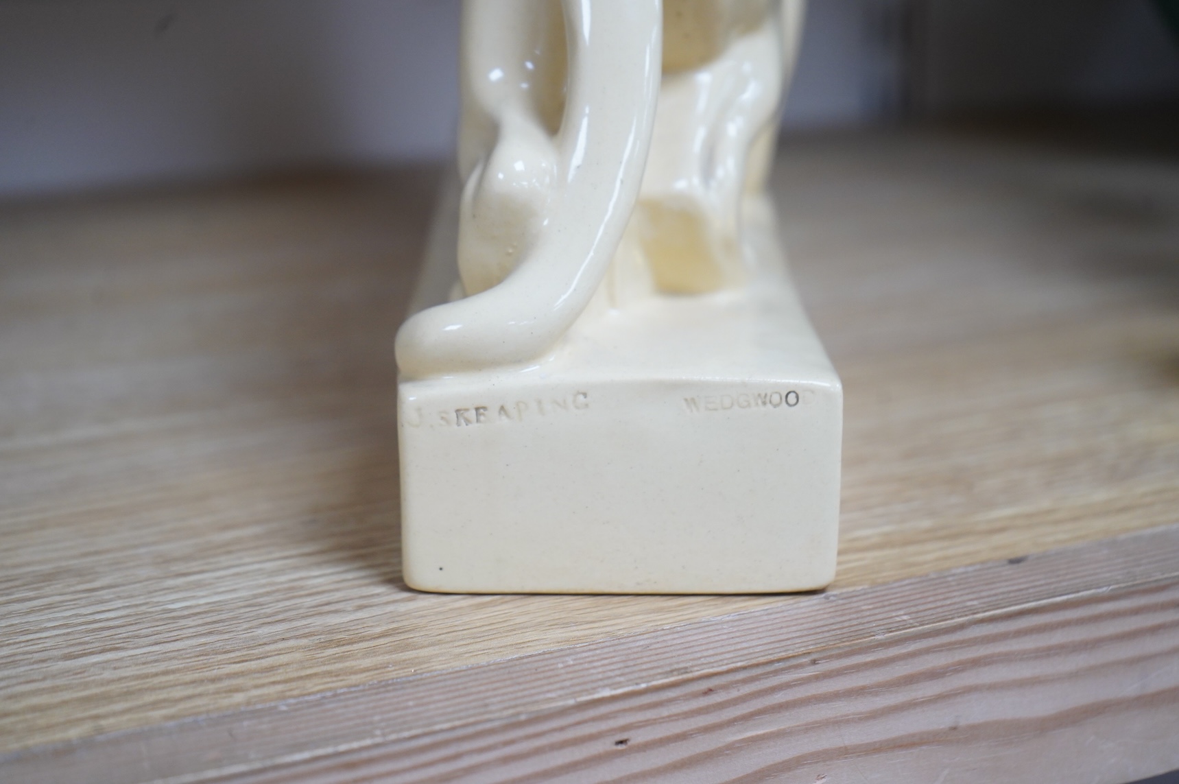 John Skeaping for Wedgwood, Art Deco sculpture of a Tiger with buck, straw glazed, 33cm wide